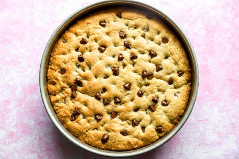 Baked cookie cake in a round cake pan.