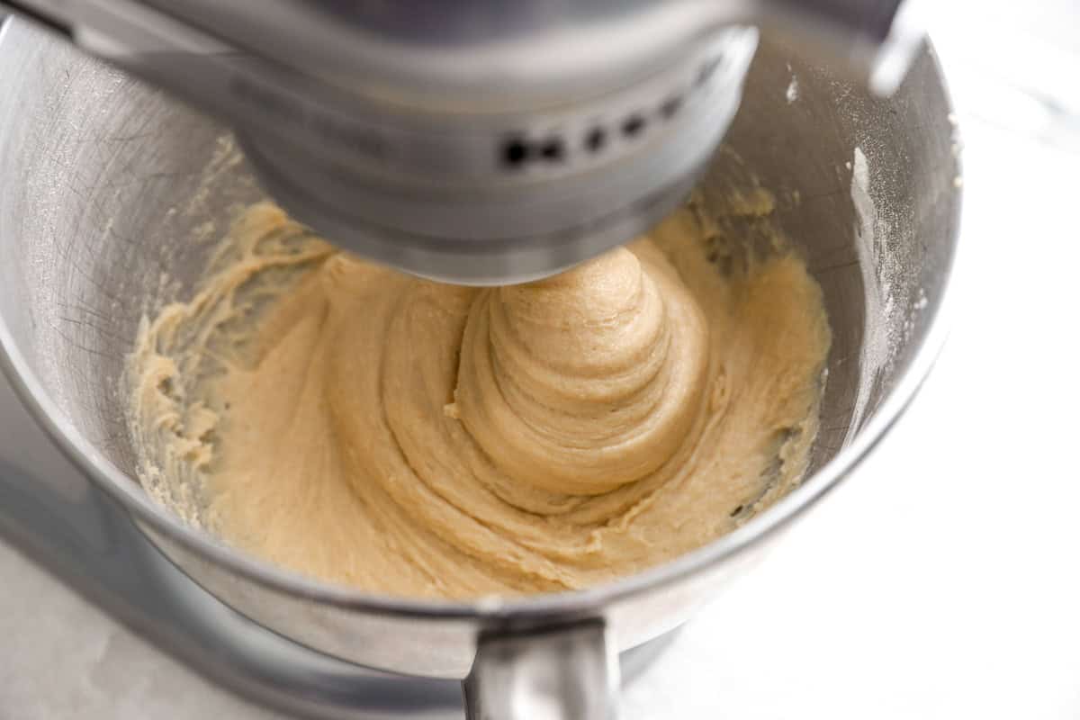 mixing bread dough in a stand mixer.