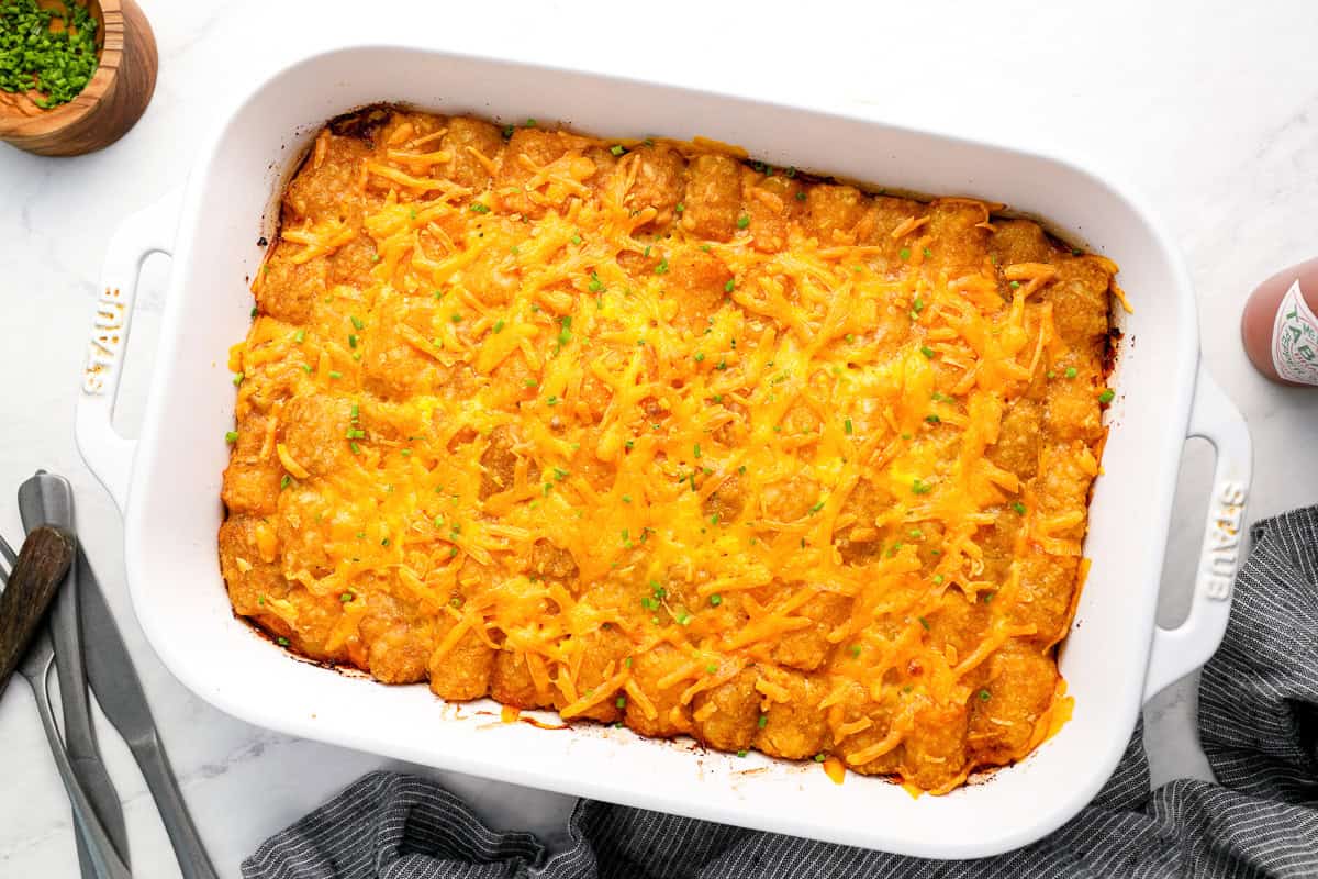 overhead view of tater tot breakfast casserole in a baking dish.