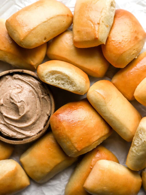 overhead view of texas roadhouse rolls with honey cinnamon butter.