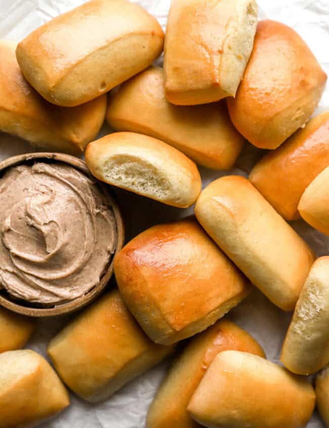 overhead view of texas roadhouse rolls with honey cinnamon butter.
