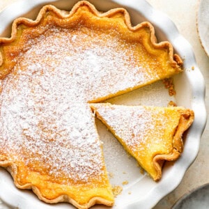 overhead view of a chess pie in a pie pan missing a slice.