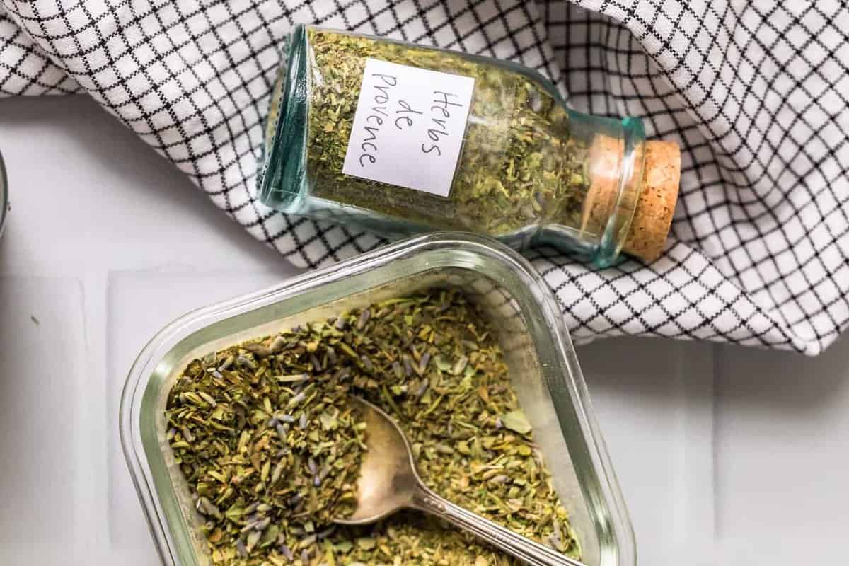 Herb mix in a glass jar and bowl