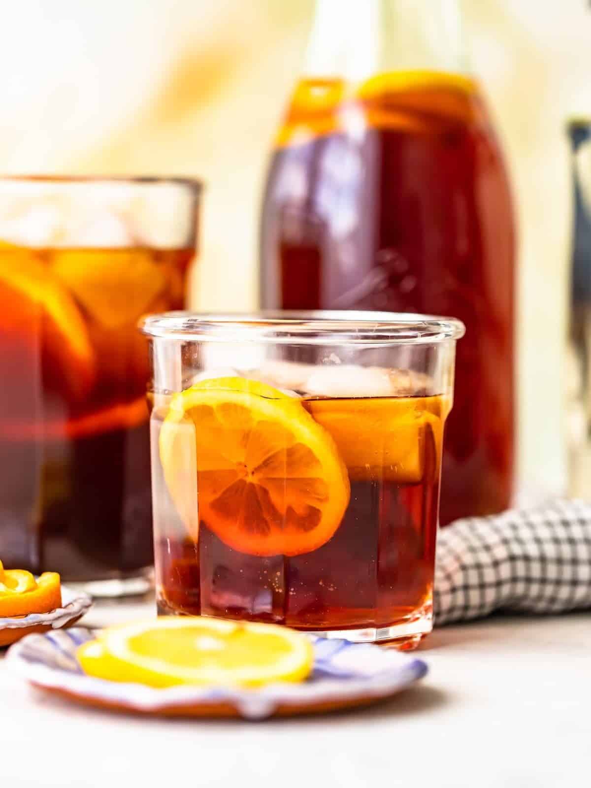 Homemade sweet tea served in a glass with a lemon slice.