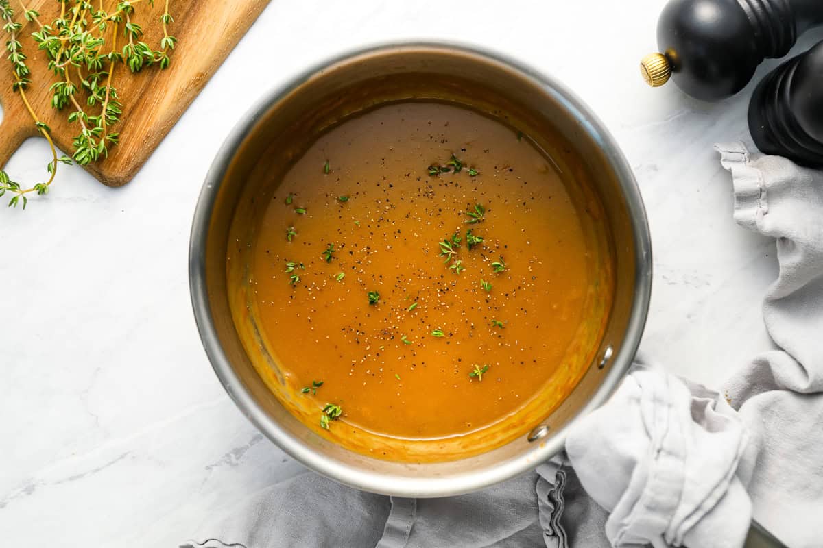 overhead view of thick brown gravy in a pot.