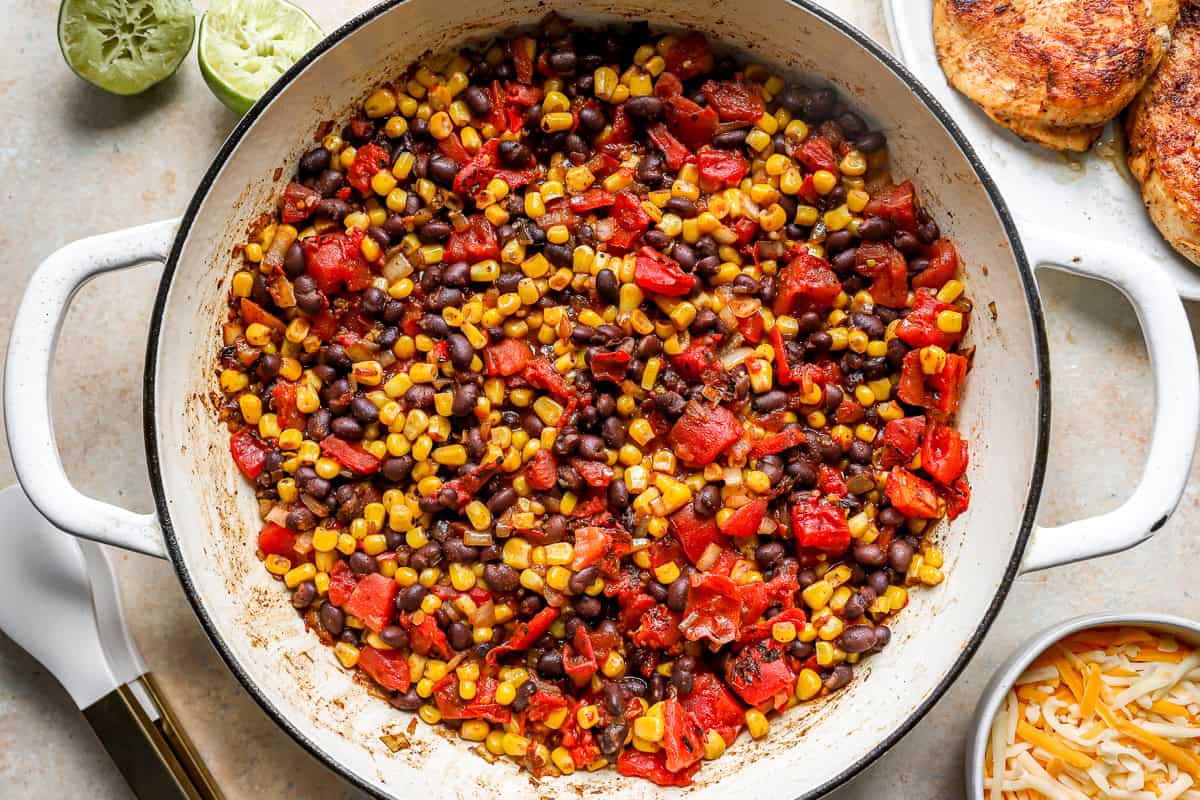 tomatoes, corn and black beans in a pan.
