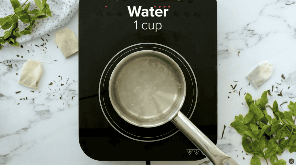 1 cup of water boiling in a small saucepan.
