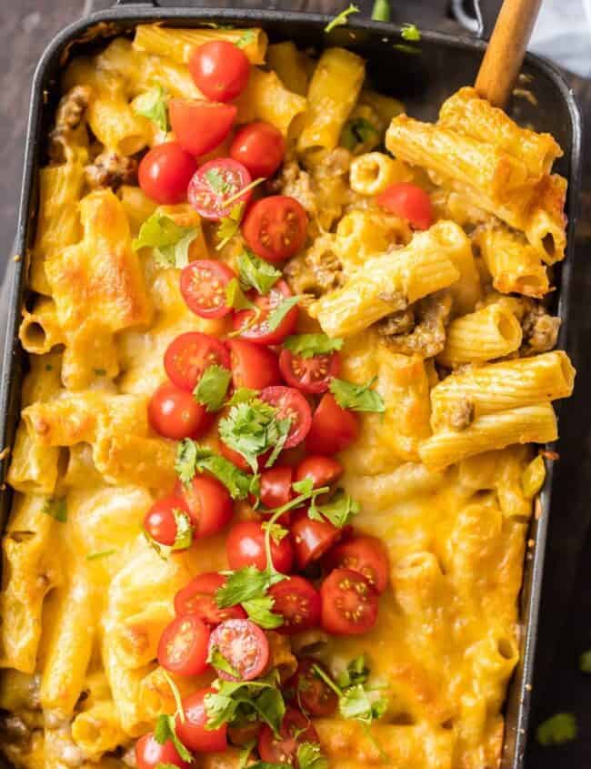 MEXICAN MAC AND CHEESE can't be beat! No need to fool with a tricky cheese sauce when you have this secret ingredient making things extra creamy and delicious. Spicy sausage and green chiles make this baked macaroni and cheese recipe soooo tasty!