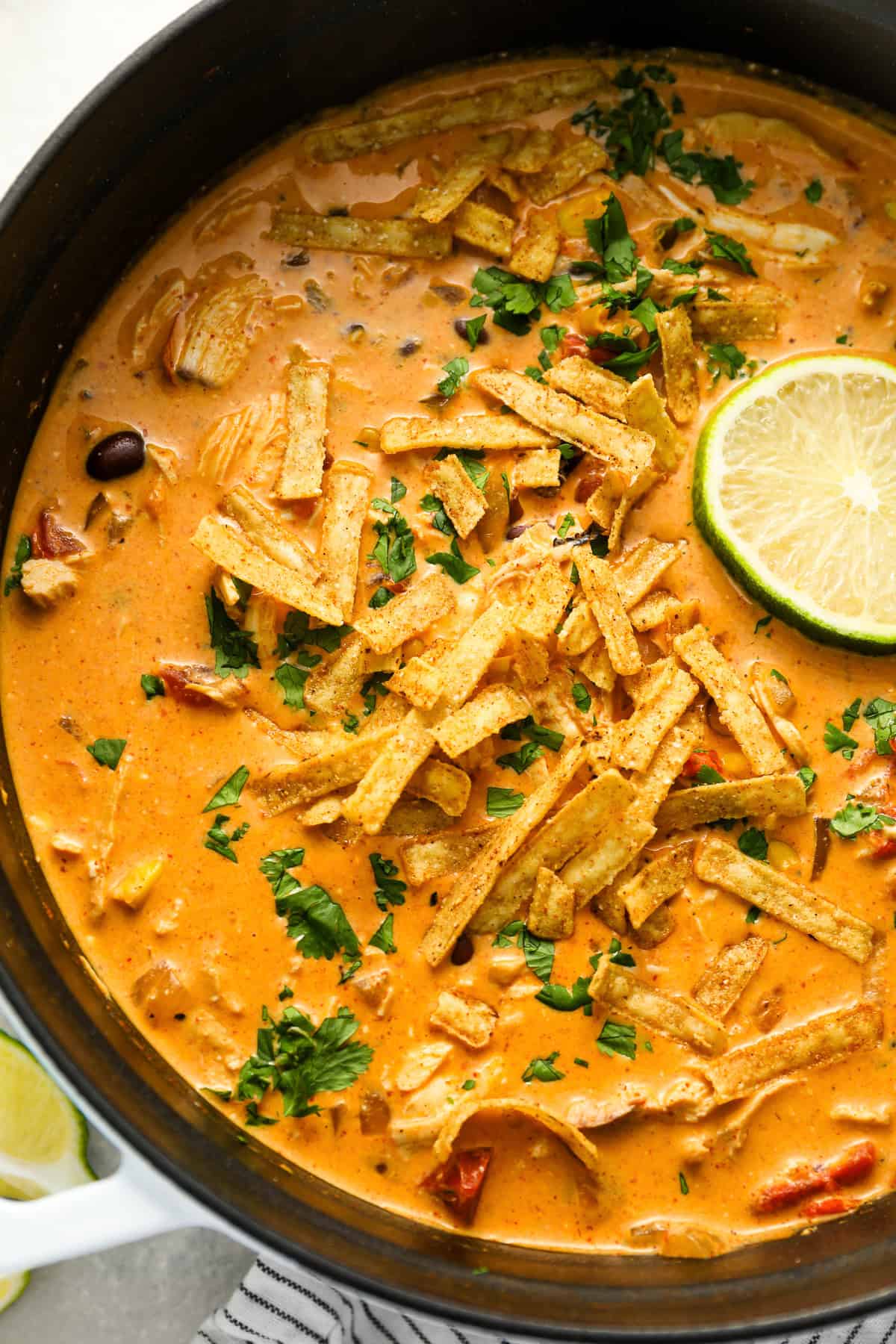 a dutch oven filled with chicken enchilada soup.