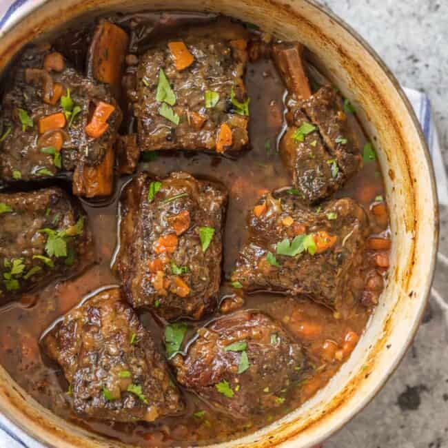 We love these DUTCH OVEN HONEY BOURBON SHORT RIBS! It's so easy to make these flavorful and fall off the bone ribs right in your dutch oven. Less cleanup and more flavor!
