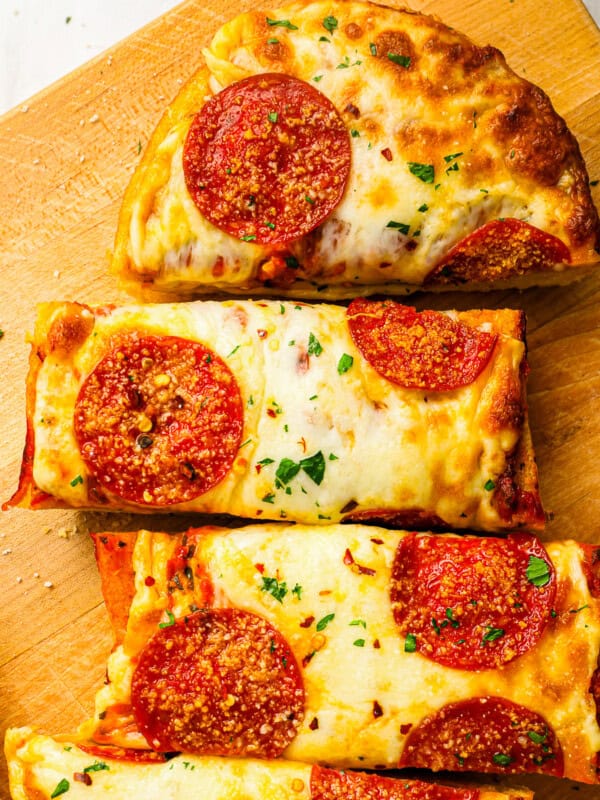 Garlic bread pizza cut into slices.