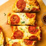 Pepperoni garlic bread pizza cut into slices.