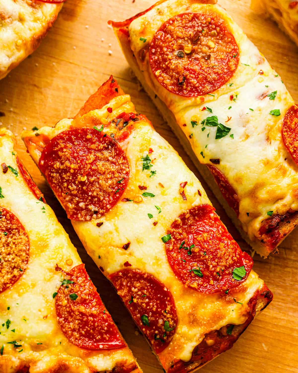 Close up on thin slices of garlic bread pizza.