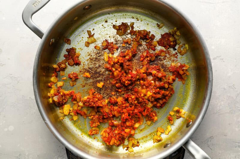 spiced sauteed onions in a pan.