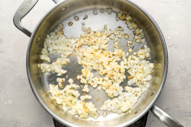 sauteed onions in a pan.