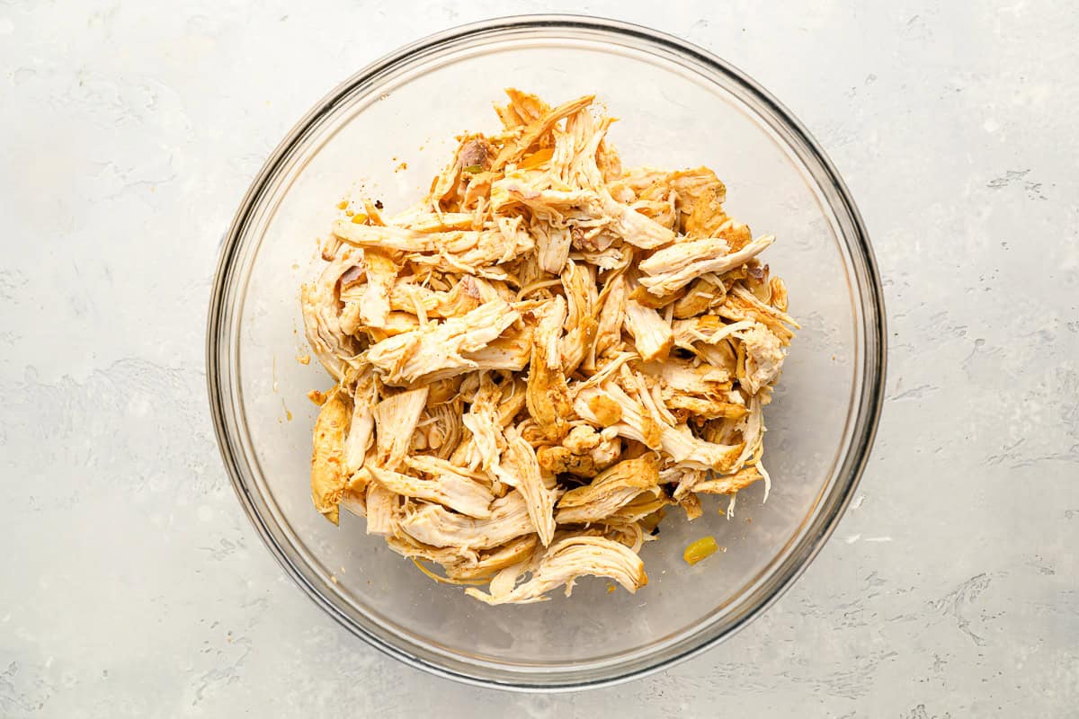 shredded chicken in a glass bowl.