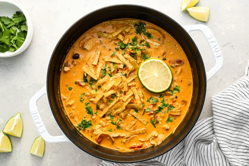 creamy chicken enchilada soup in a dutch oven.