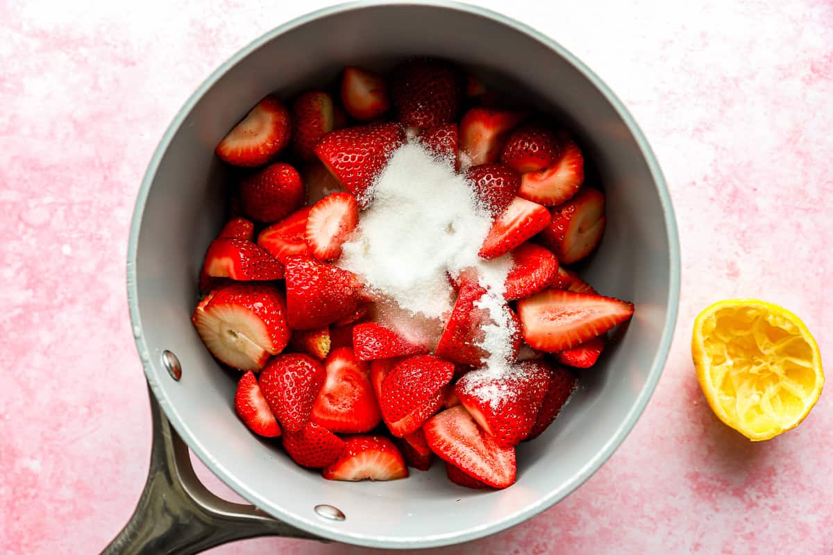 strawberries and sugar in a saucepan.