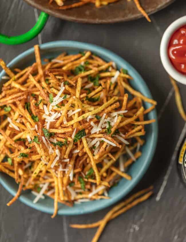 a bowl of shoestring fries