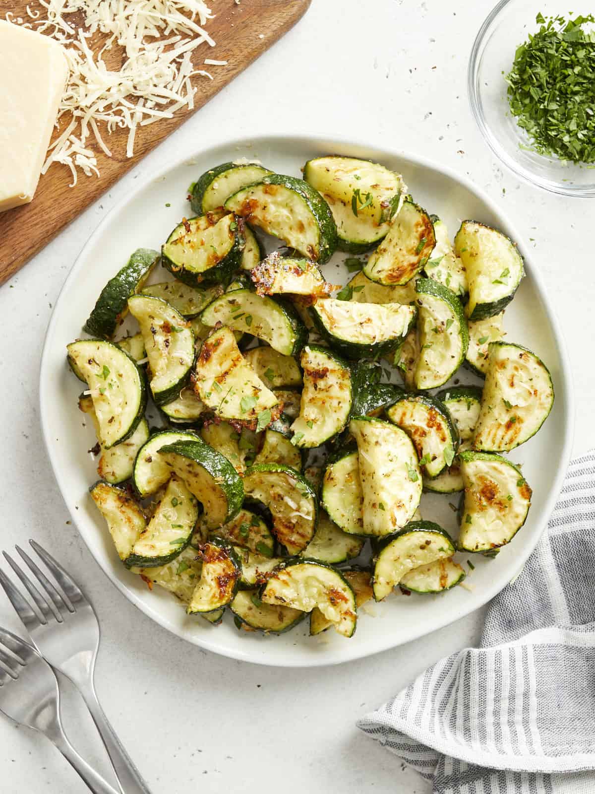 roasted zucchini on a white plate.