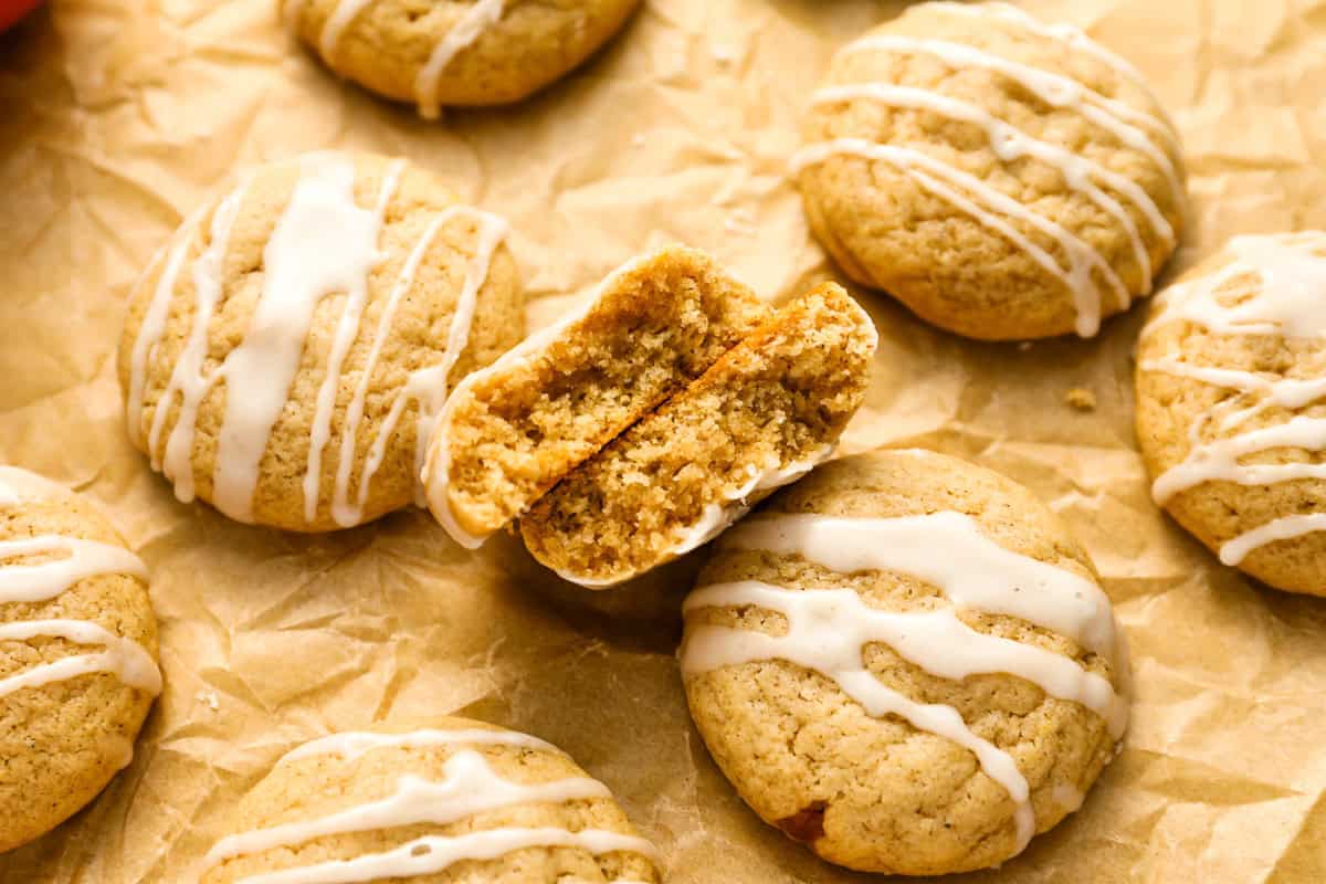 a halved apple cider cookie leaning on another cookie to show the interior.