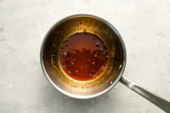 reduced spiced apple cider in a saucepan.