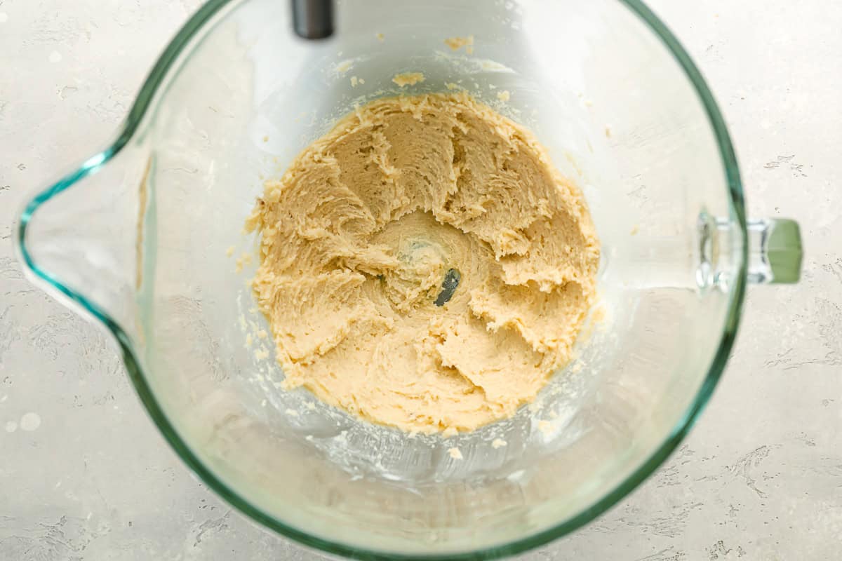 creamed butter and sugar in a glass stand mixer bowl.