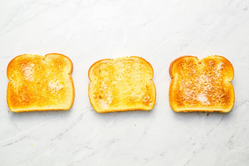 3 buttered and toasted slices of bread.