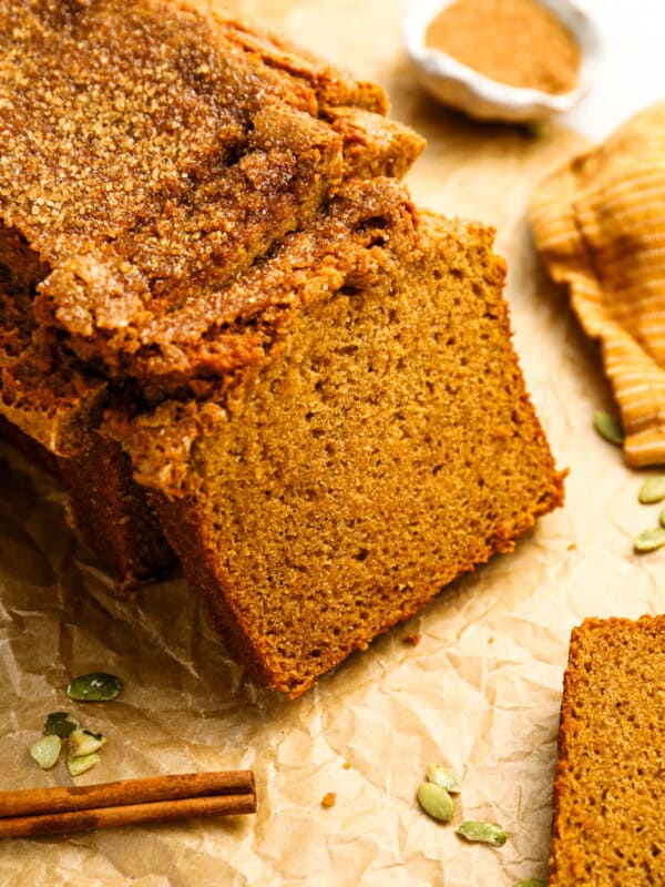 a partially sliced loaf of pumpkin bread.