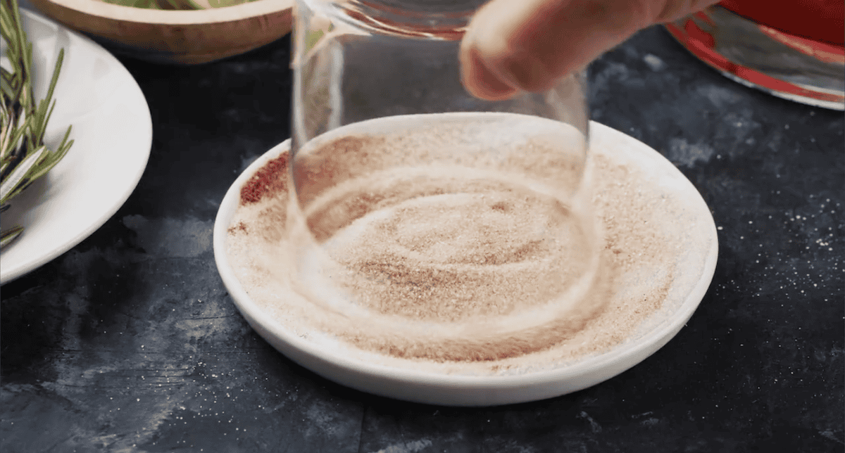 Dipping the rim of a glass in sugar.