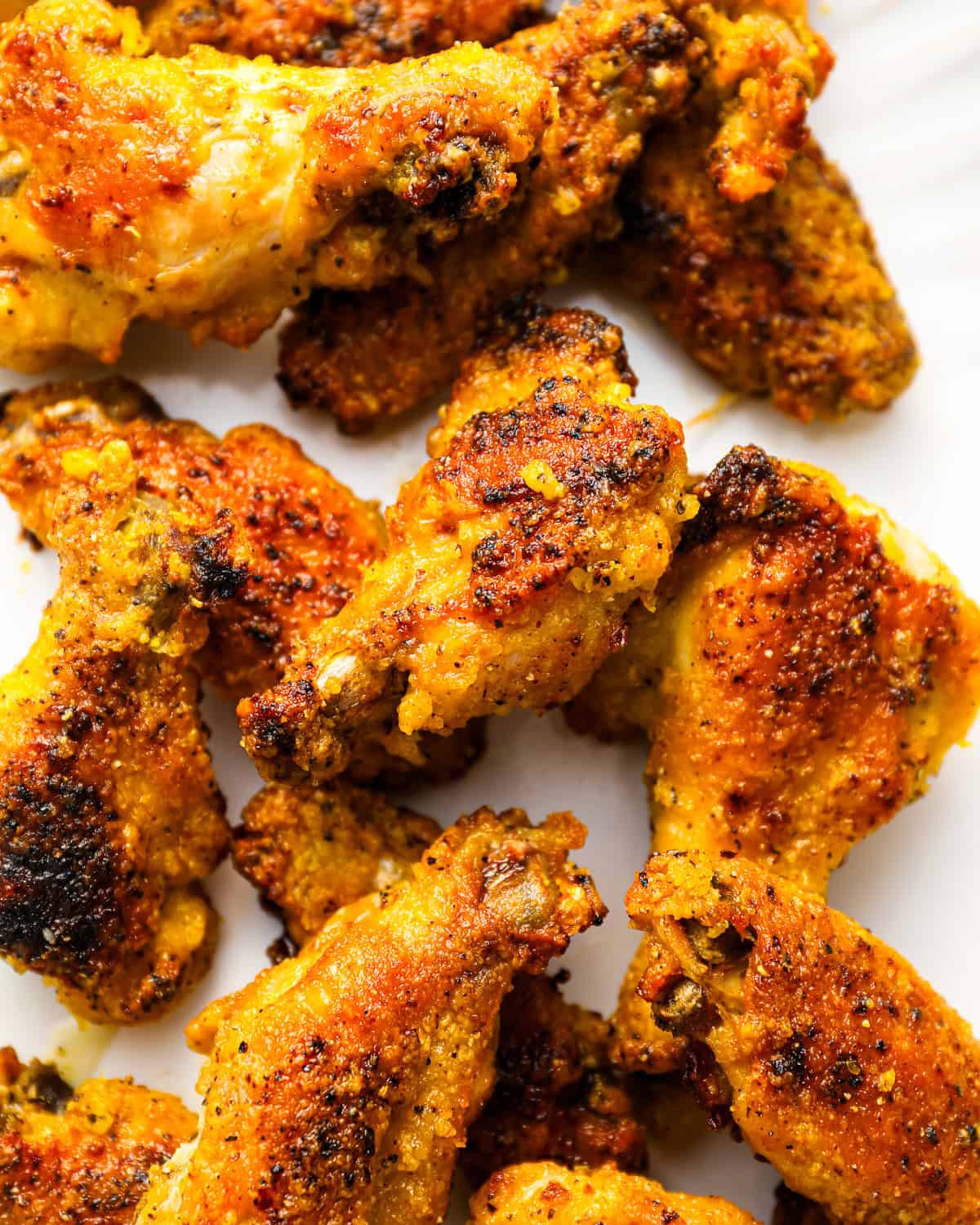 closeup photo of a bunch of crispy lemon pepper wings