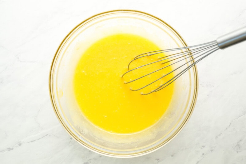 whisked eggs in a glass bowl.