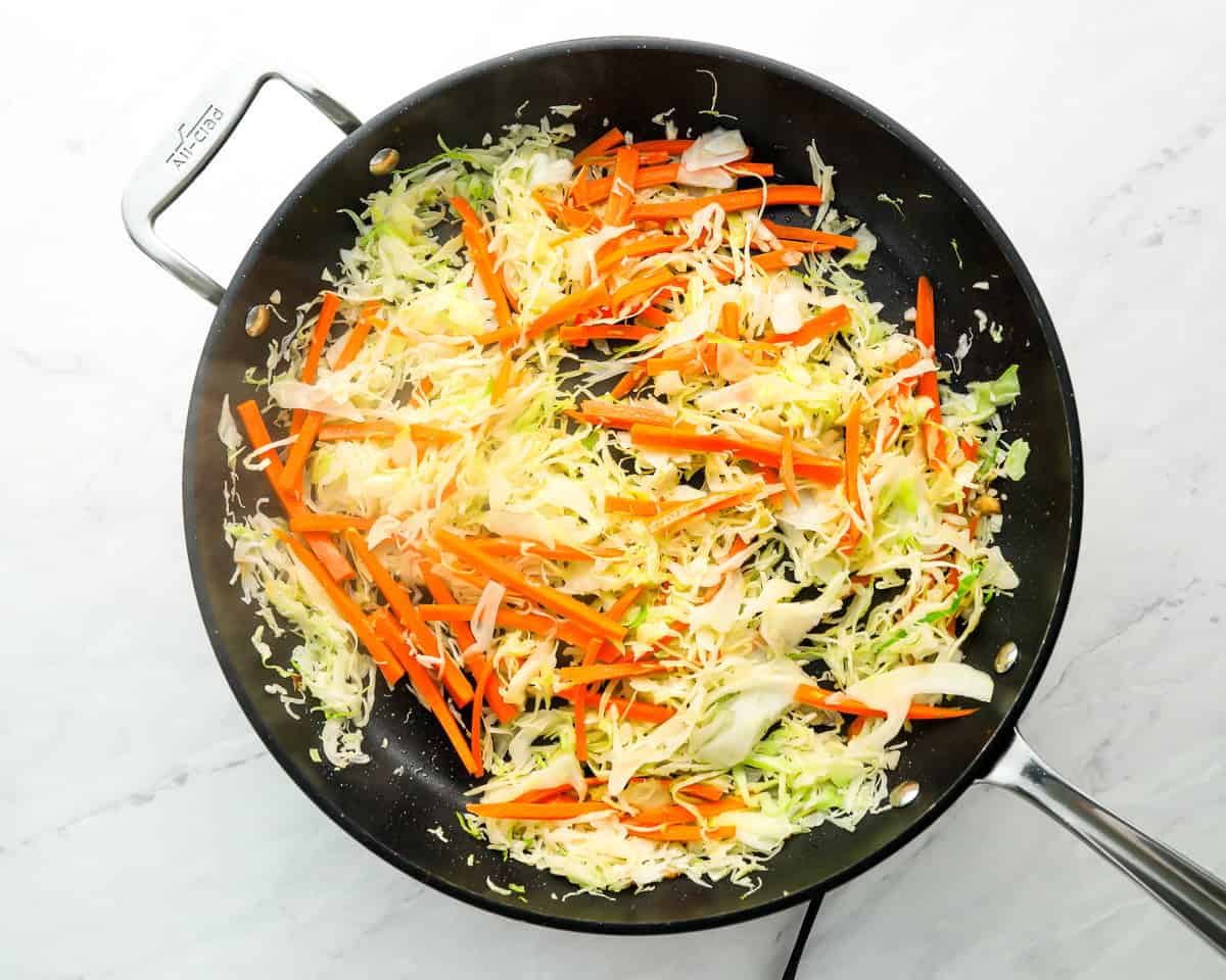 stir fry veggies cooking in black skillet