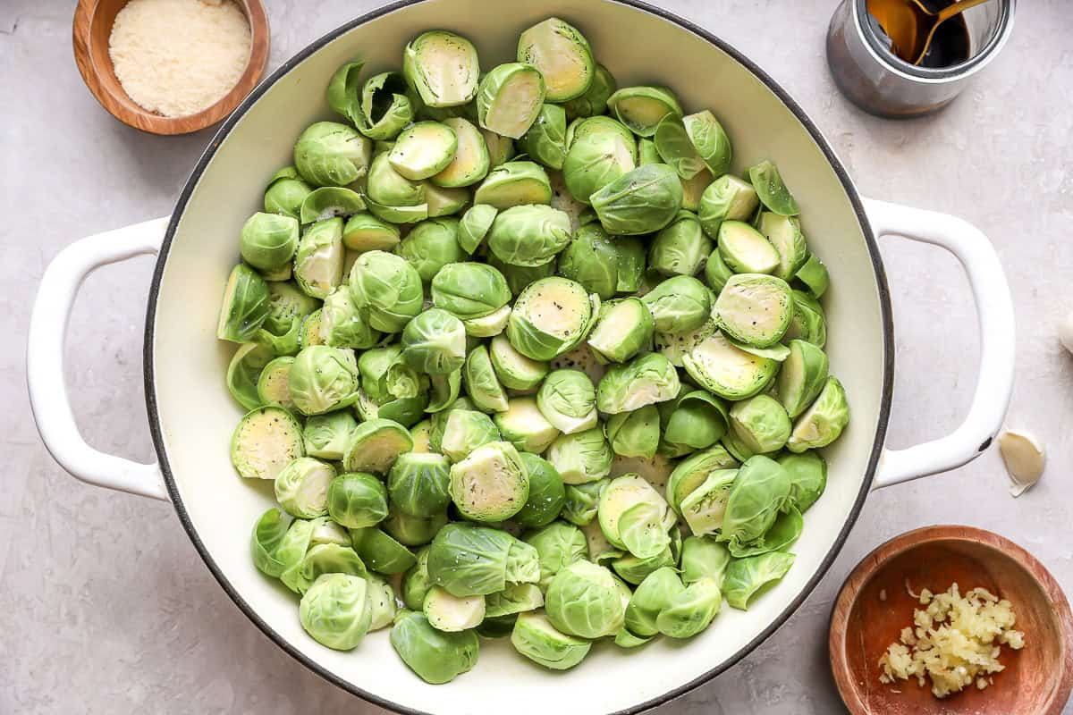 raw cut brussels sprouts in a pan.