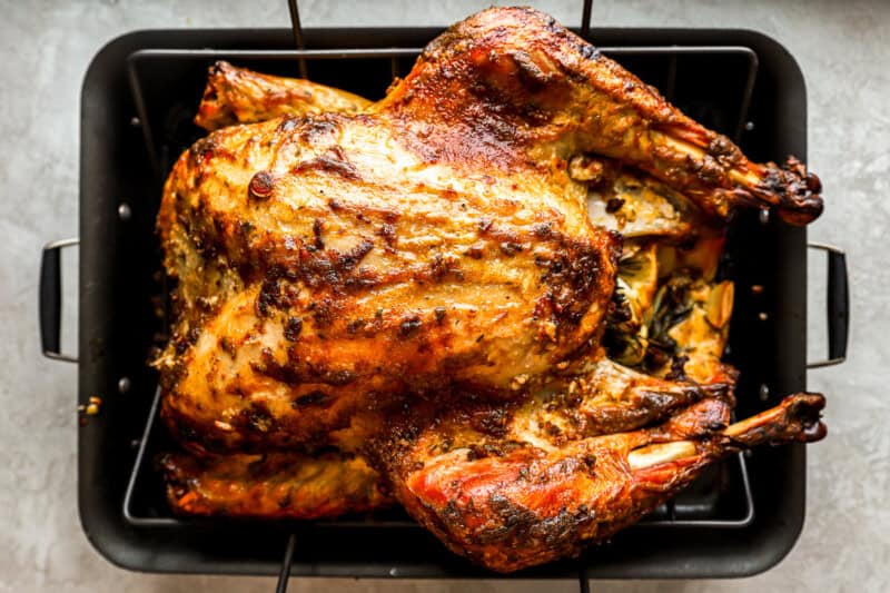 mayonnaise roasted turkey in a roasting pan.