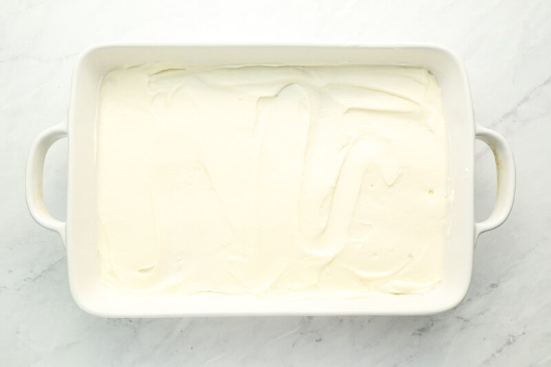 creamy white spread in a baking pan.