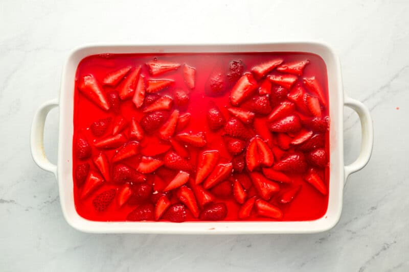 overhead view of strawberry pretzel salad in a baking pan.