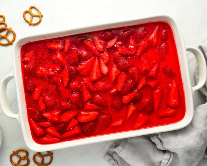 overhead view of strawberry pretzel salad in a baking pan.