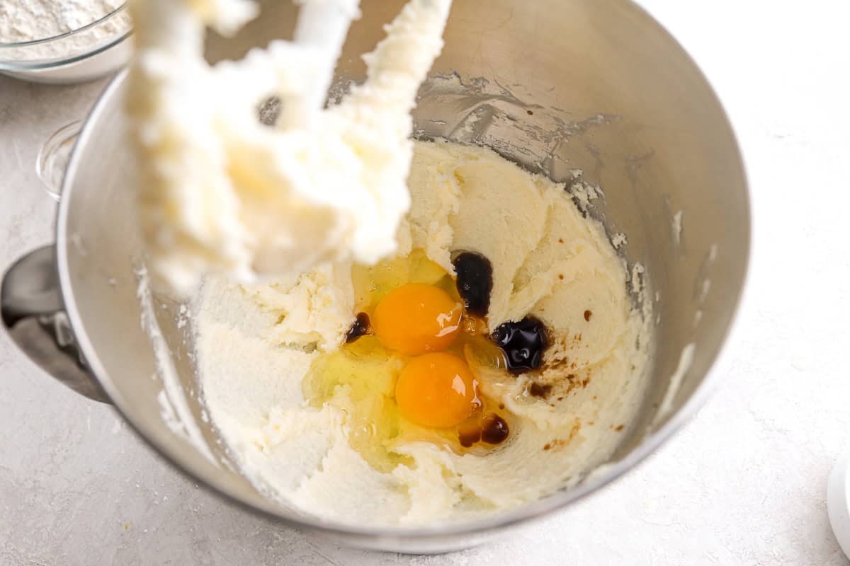 eggs and vanilla on creamed butter in a stand mixer bowl.