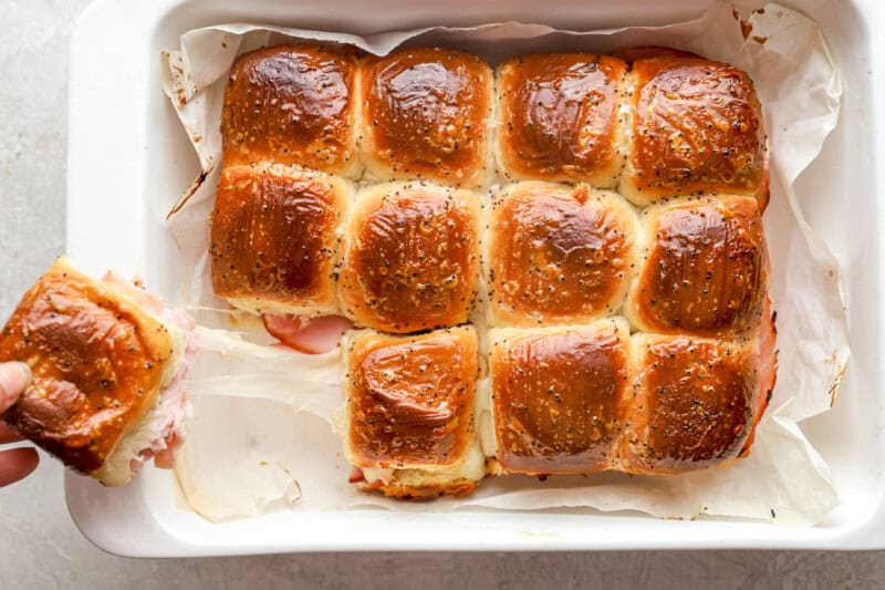 Hawaiian roll sliders in a baking dish.