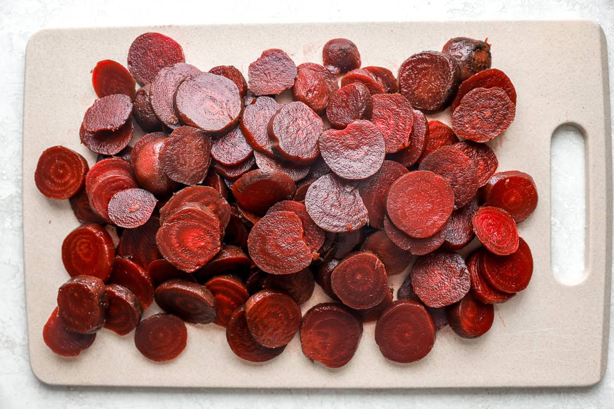 sliced beets on a cutting board.