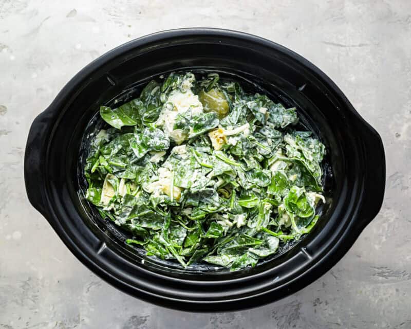 spinach artichoke dip ingredients in a crockpot.