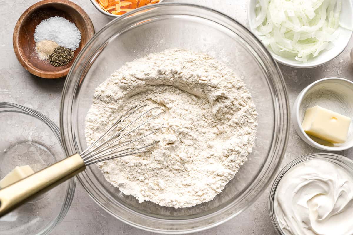 flour in a bowl with a whisk.